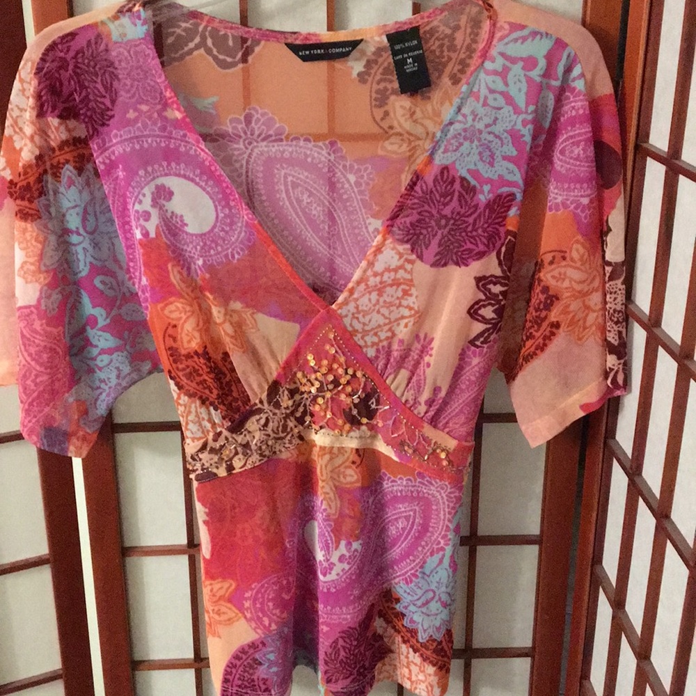 Sheer v-neck blouse. Beaded front. Ties in back!